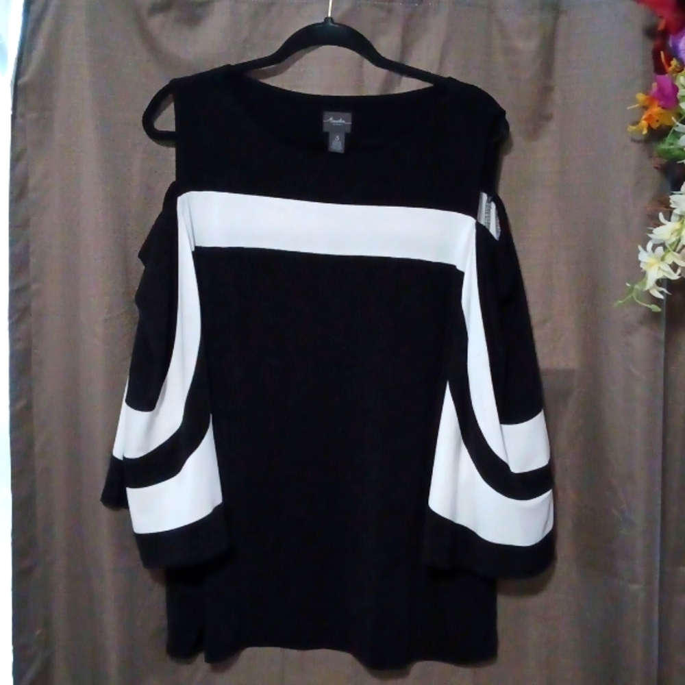 Chicos  Beautiful Statement top! Size 3. Black and white  cold  shoulder